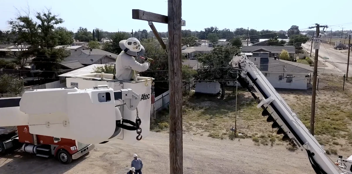 Ingram Professional Services crew working from a bucket truck in a still from the onboarding project